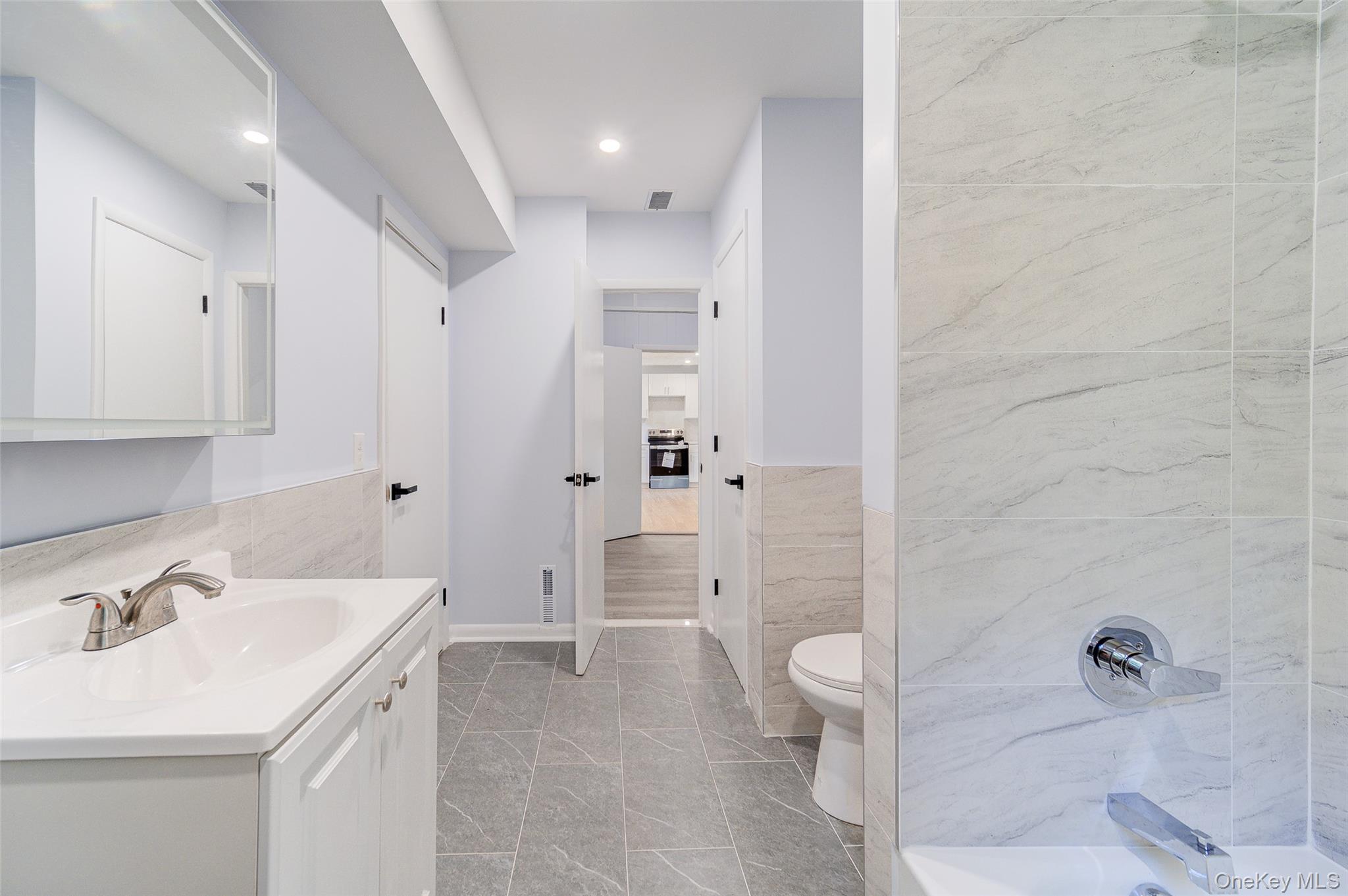 219 Benedict Road Montgomery, NY 12549 - Photo 18 of 50 a bathroom with a sink a toilet and shower