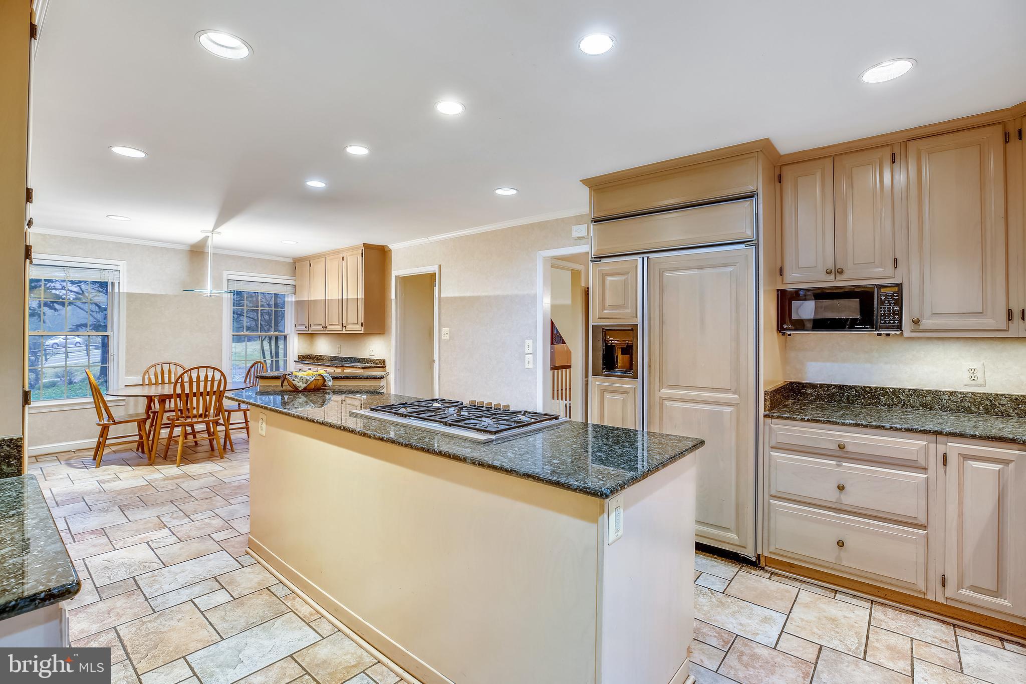 11781 Gainsborough Road Potomac, MD 20854 - Photo 17 of 65 Huge Kitchen island includes gas cooktop