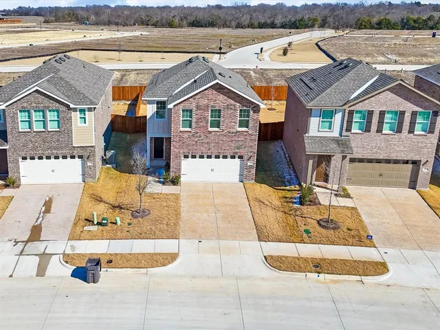 a aerial view of a house with swimming pool and patio