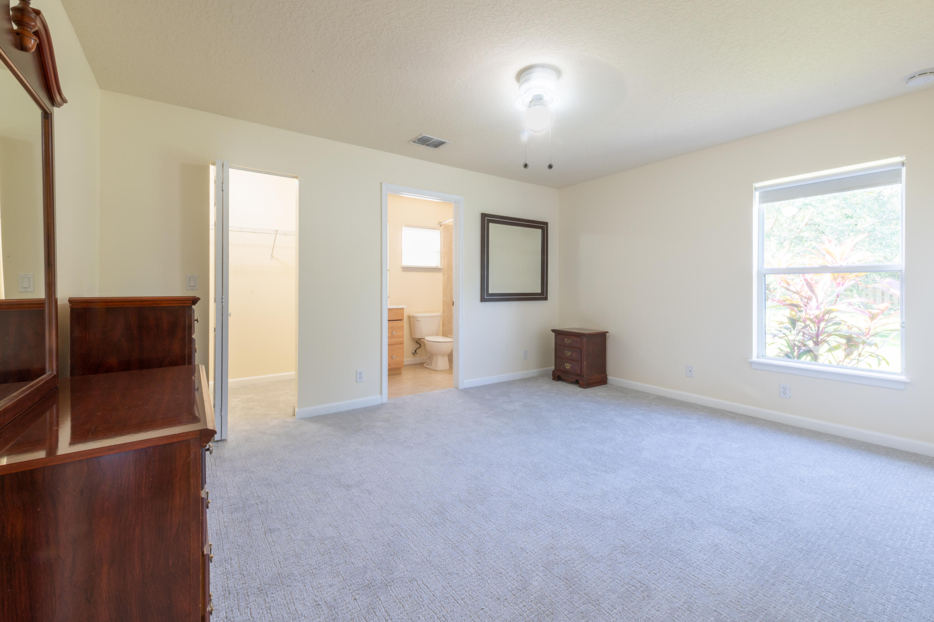 1470 Southwest Gadsan Avenue Port St. Lucie, FL 34953 - Photo 3 of 6 a view of a livingroom with a staircase