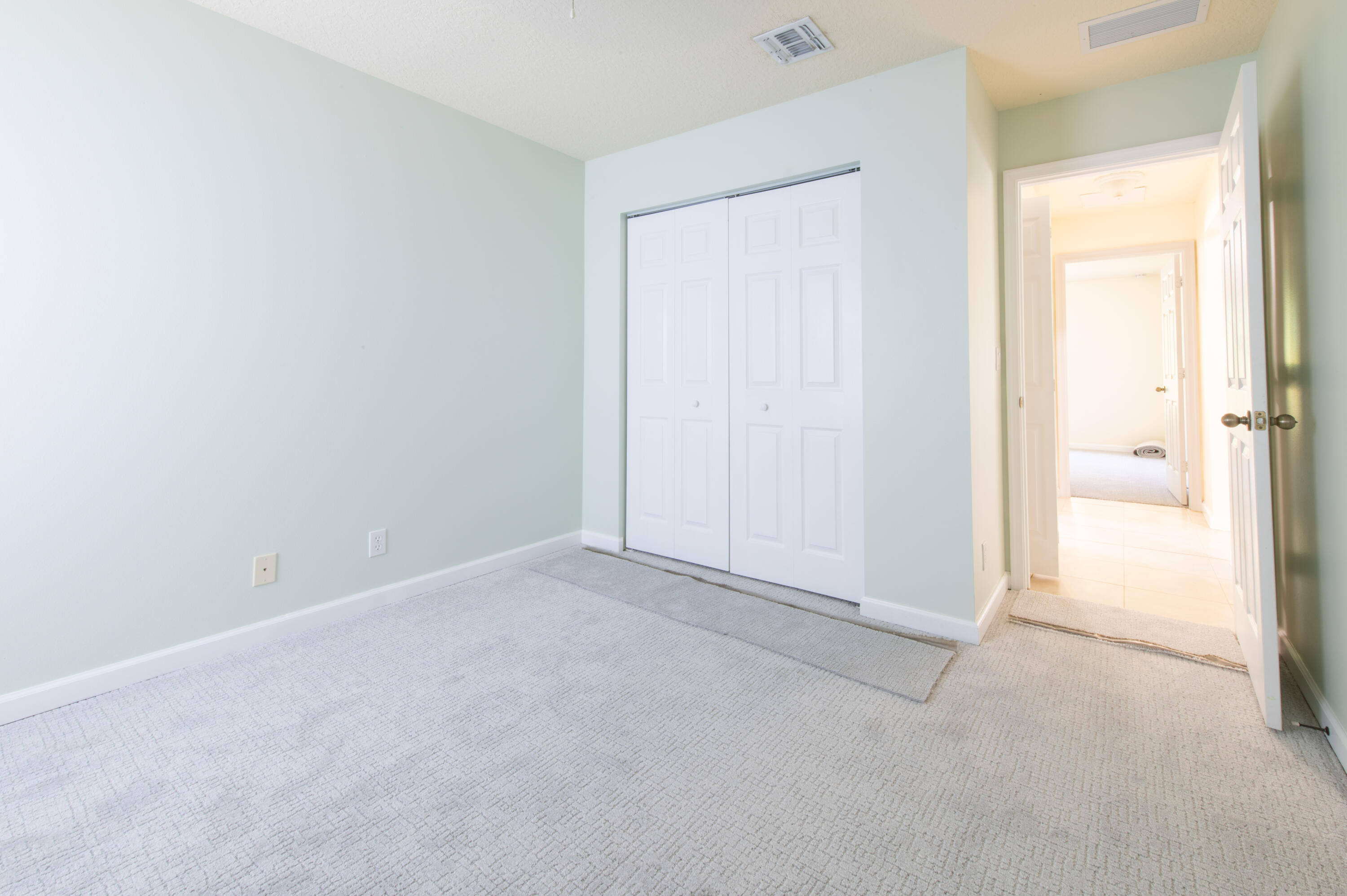 1470 Southwest Gadsan Avenue Port St. Lucie, FL 34953 - Photo 5 of 6 a view of an empty room and closet area