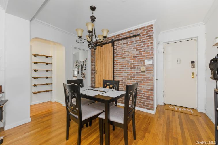 765 Bronx River Road, Unit 2I Bronxville, NY 10708 - Photo 3 of 13 a view of a dining room with furniture and wooden floor