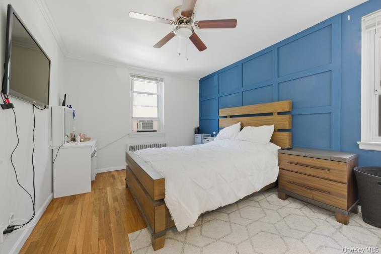 765 Bronx River Road, Unit 2I Bronxville, NY 10708 - Photo 7 of 13 a bedroom with a bed and a flat tv screen on the dresser