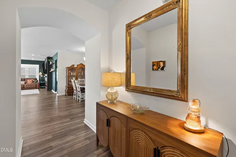 a view of a dining room with furniture wooden floor and chandelier