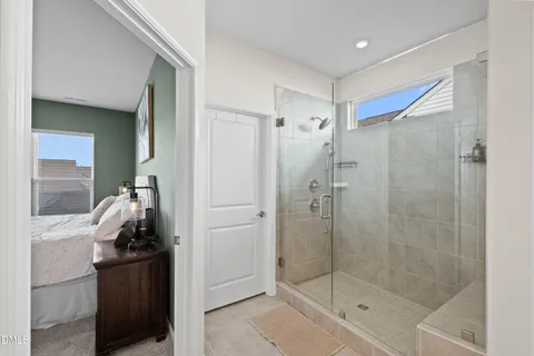 a bathroom with a sink vanity mirror and toilet
