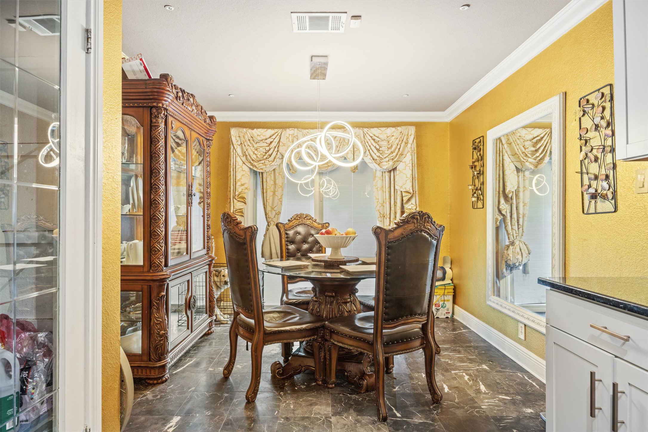 14409 Sandifer Street Austin, TX 78725 - Photo 9 of 31 Dining area featuring ornamental molding and a chandelier