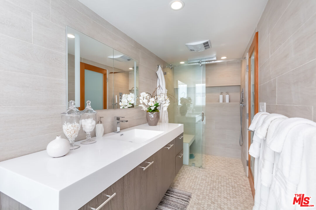 18 Union Jack Street, Unit 302 Marina del Rey, CA 90292 - Photo 16 of 19 a bathroom with a double vanity sink mirror and