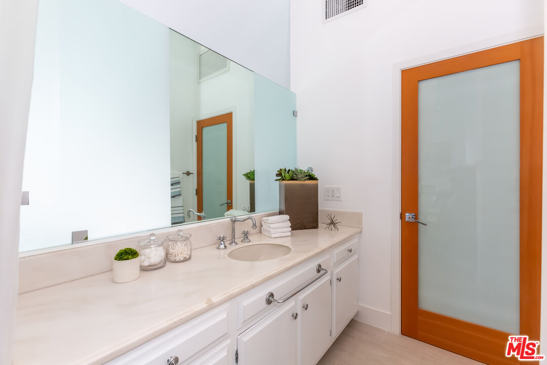 18 Union Jack Street, Unit 302 Marina del Rey, CA 90292 - Photo 17 of 19 a bathroom with a sink and a mirror