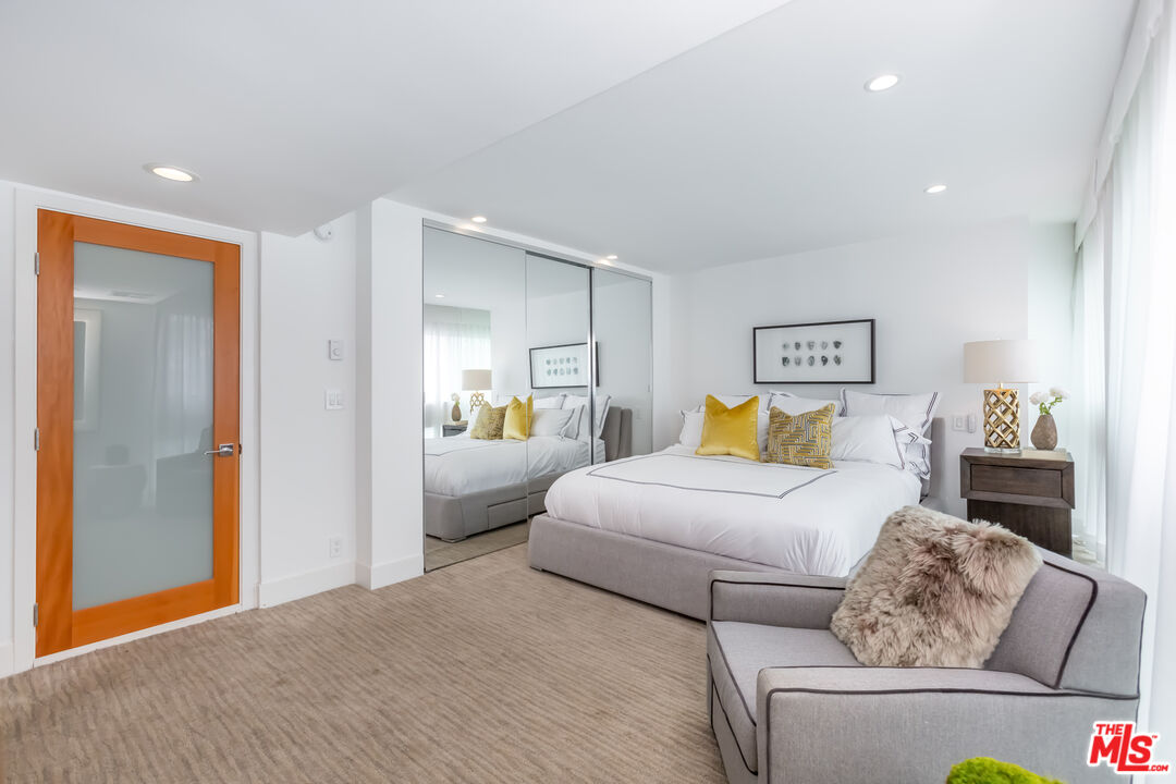 18 Union Jack Street, Unit 302 Marina del Rey, CA 90292 - Photo 9 of 19 a bedroom with a bed and a couch