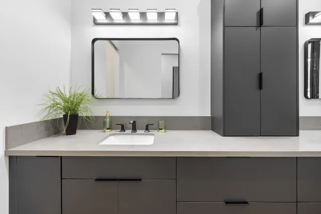 a bathroom with a sink and a mirror