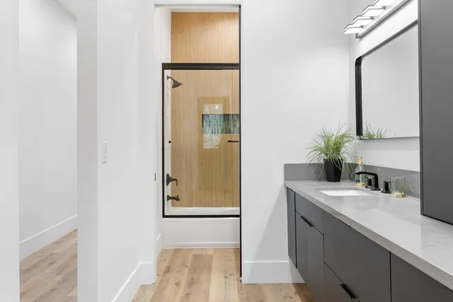 a bathroom with a sink and a mirror