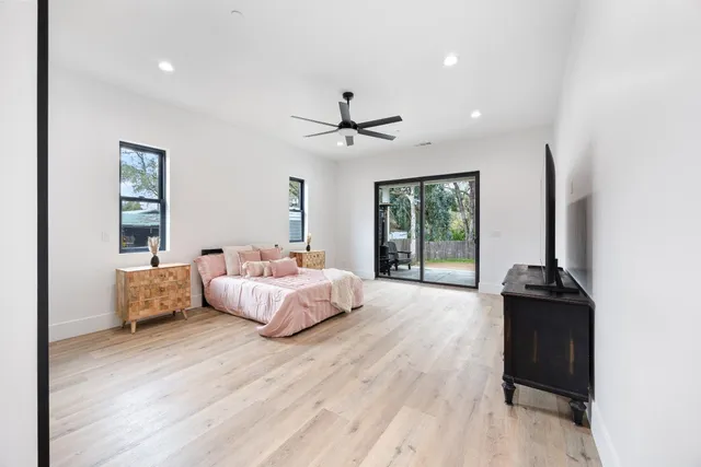 a bed room with bed and window