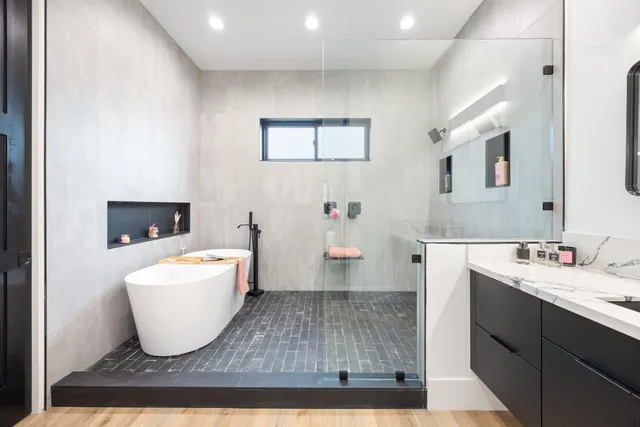 a room with a sink and a mirror