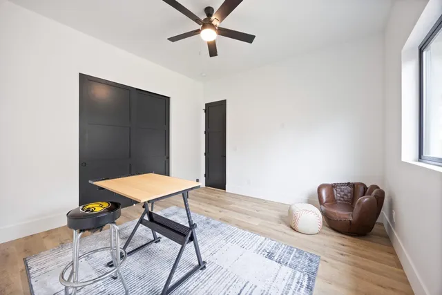 a bedroom with furniture and a window