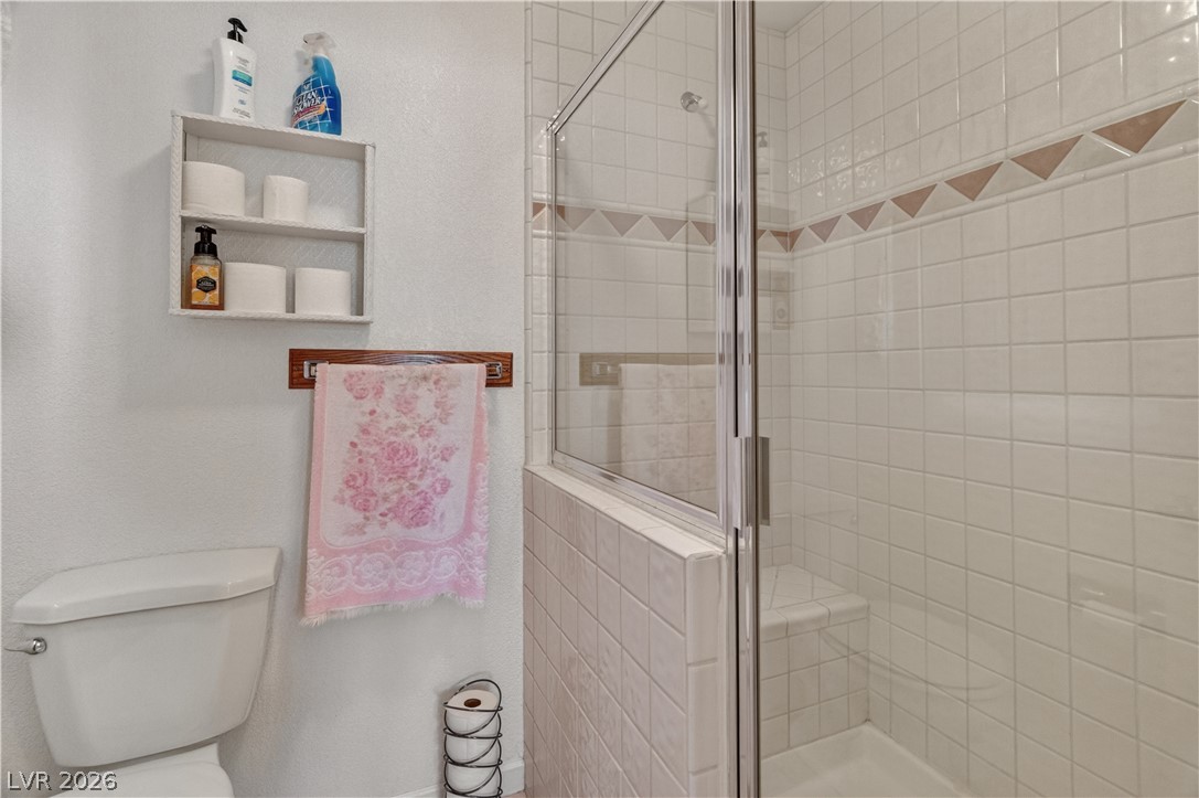 2055 Cholla Way Laughlin, NV 89029 - Photo 37 of 87 White subway tiles adorn this bathroom, offering a shower with a built-in bench.