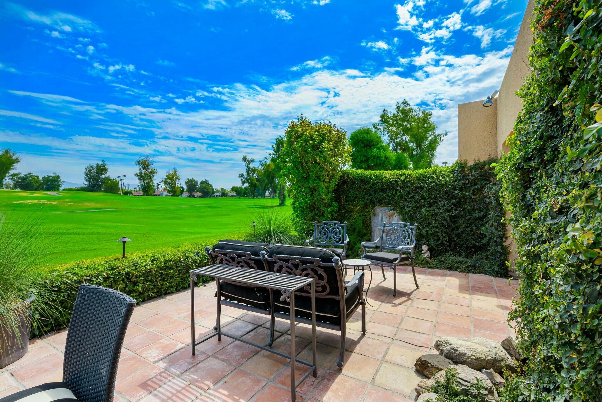 38 Mission Court Rancho Mirage, CA 92270 - Photo 47 of 61 a view of a backyard with sitting area furniture and garden