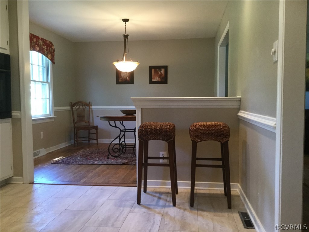 3701 Applewood Road North Chesterfield, VA 23234 - Photo 5 of 15 a view of a livingroom with furniture wooden floor and a window