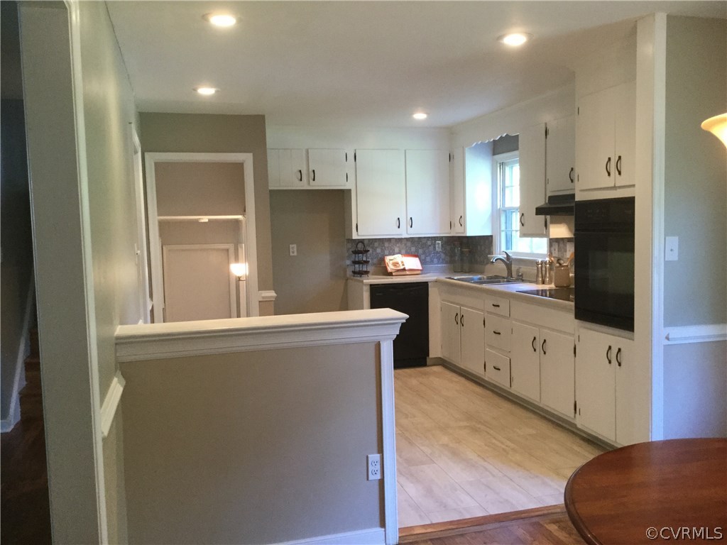 3701 Applewood Road North Chesterfield, VA 23234 - Photo 6 of 15 a kitchen with stainless steel appliances granite countertop a stove a sink a refrigerator and white cabinets with wooden floor
