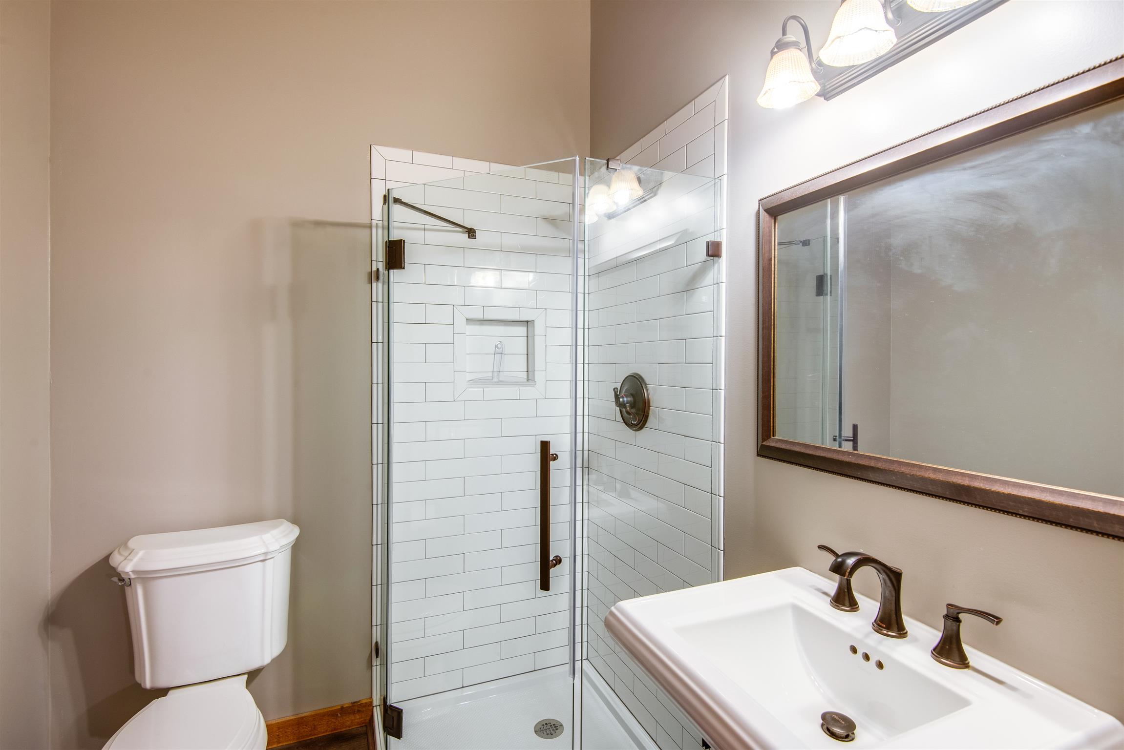 3198 Arnold Road Centerville, TN 37033 - Photo 14 of 30 Secondary Bathroom also w/ subway tiled shower