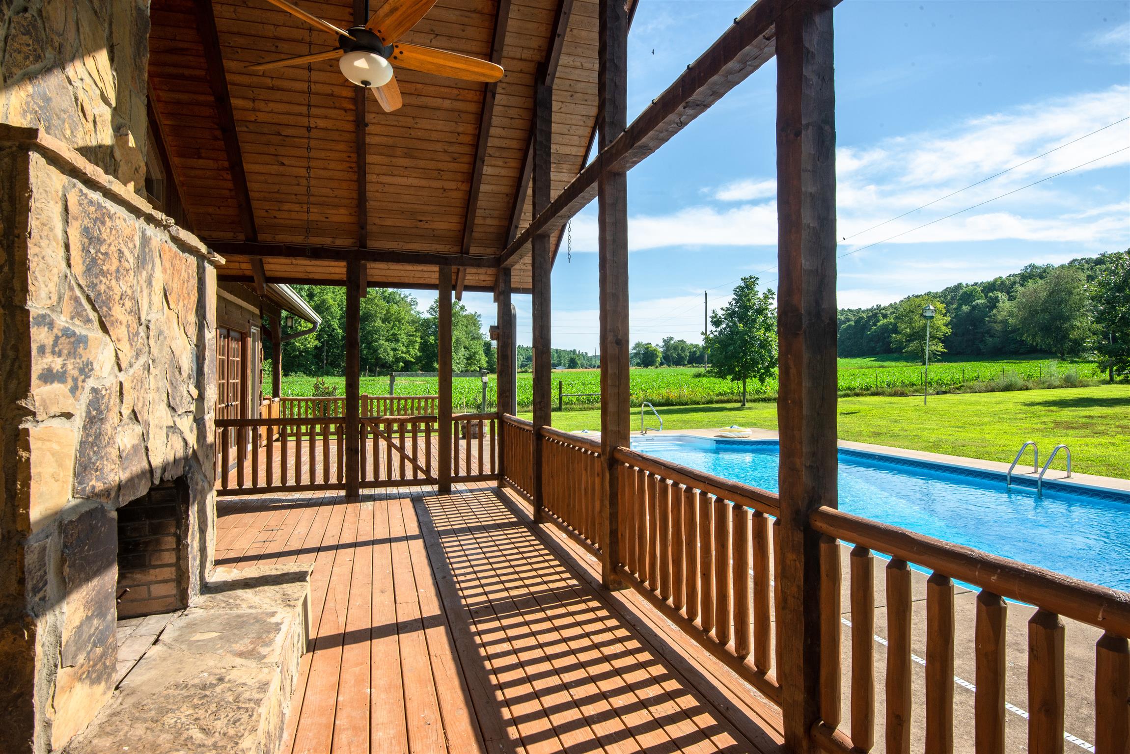 3198 Arnold Road Centerville, TN 37033 - Photo 21 of 30 Deck overlooking pool w/ outdoor wood burning fireplace - fall in love w/ the notched western cedar wood notes