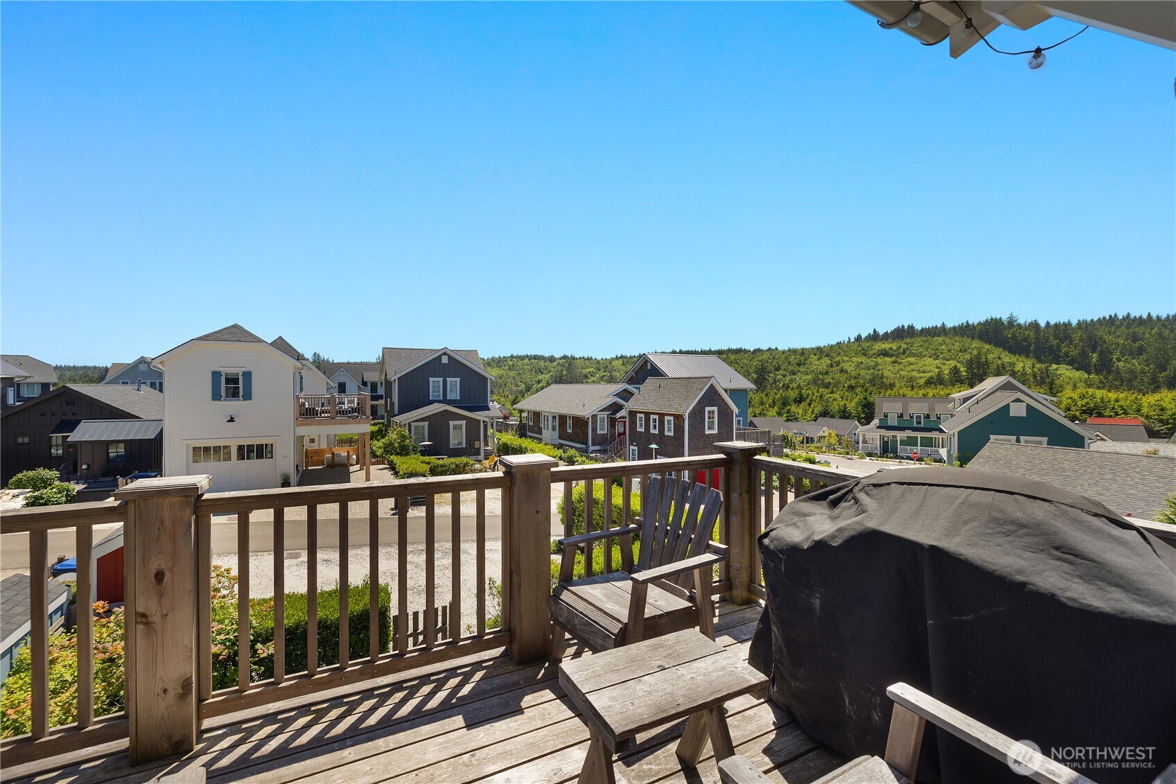 61 Horizon Street Pacific Beach, WA 98571 - Photo 10 of 29 a view of a city from a balcony with furniture
