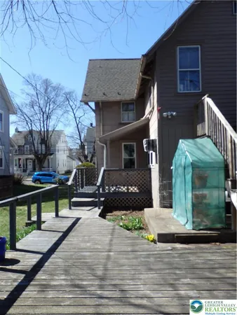 a view of a brick house with a patio