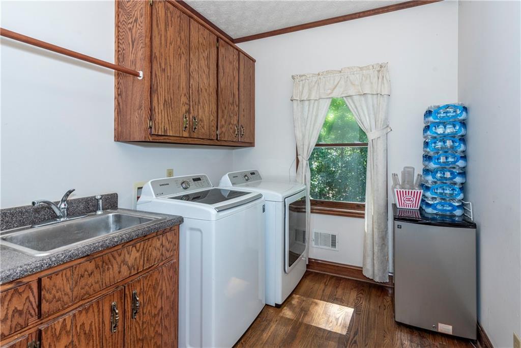 755 Harris Road Jasper, GA 30143 - Photo 21 of 54 a kitchen with granite countertop a sink and a window