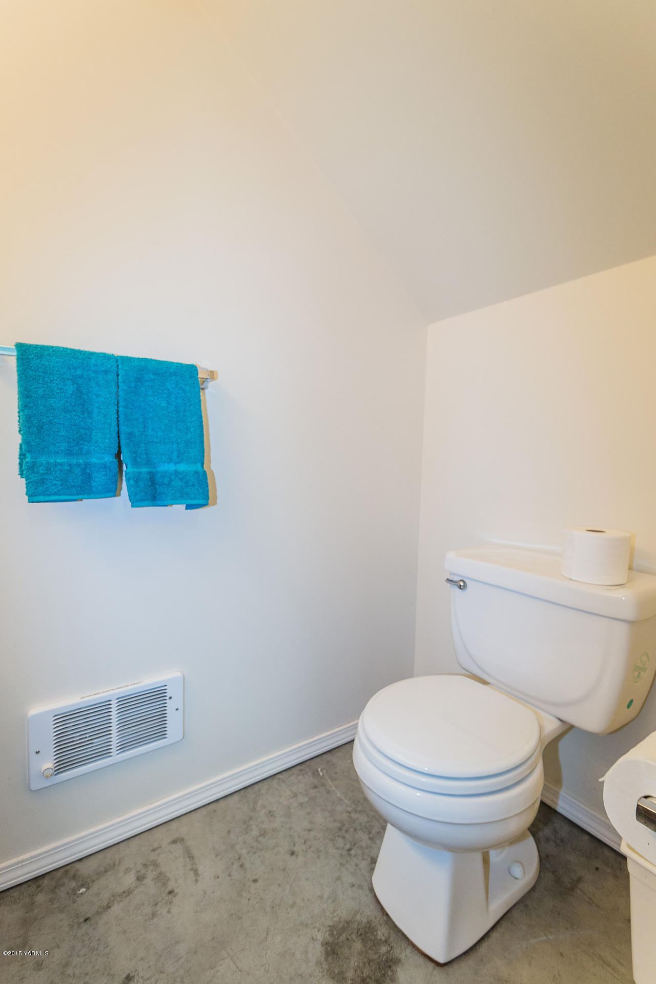 2971 Nelson Road Yakima, WA 98903 - Photo 38 of 43 a bathroom with a toilet and a picture of the wall