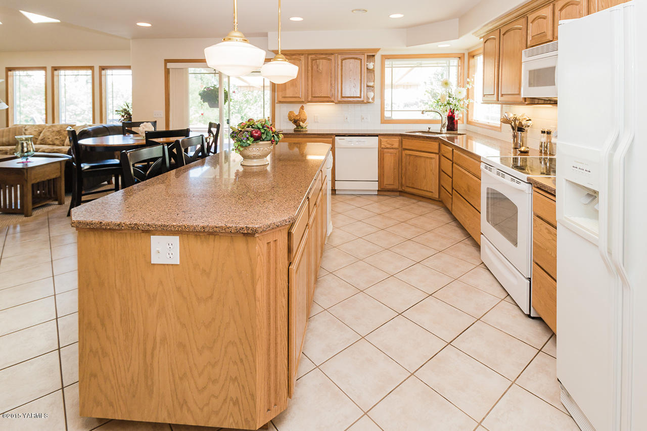 2971 Nelson Road Yakima, WA 98903 - Photo 6 of 43 a kitchen with stainless steel appliances granite countertop a sink counter space and a stove top oven