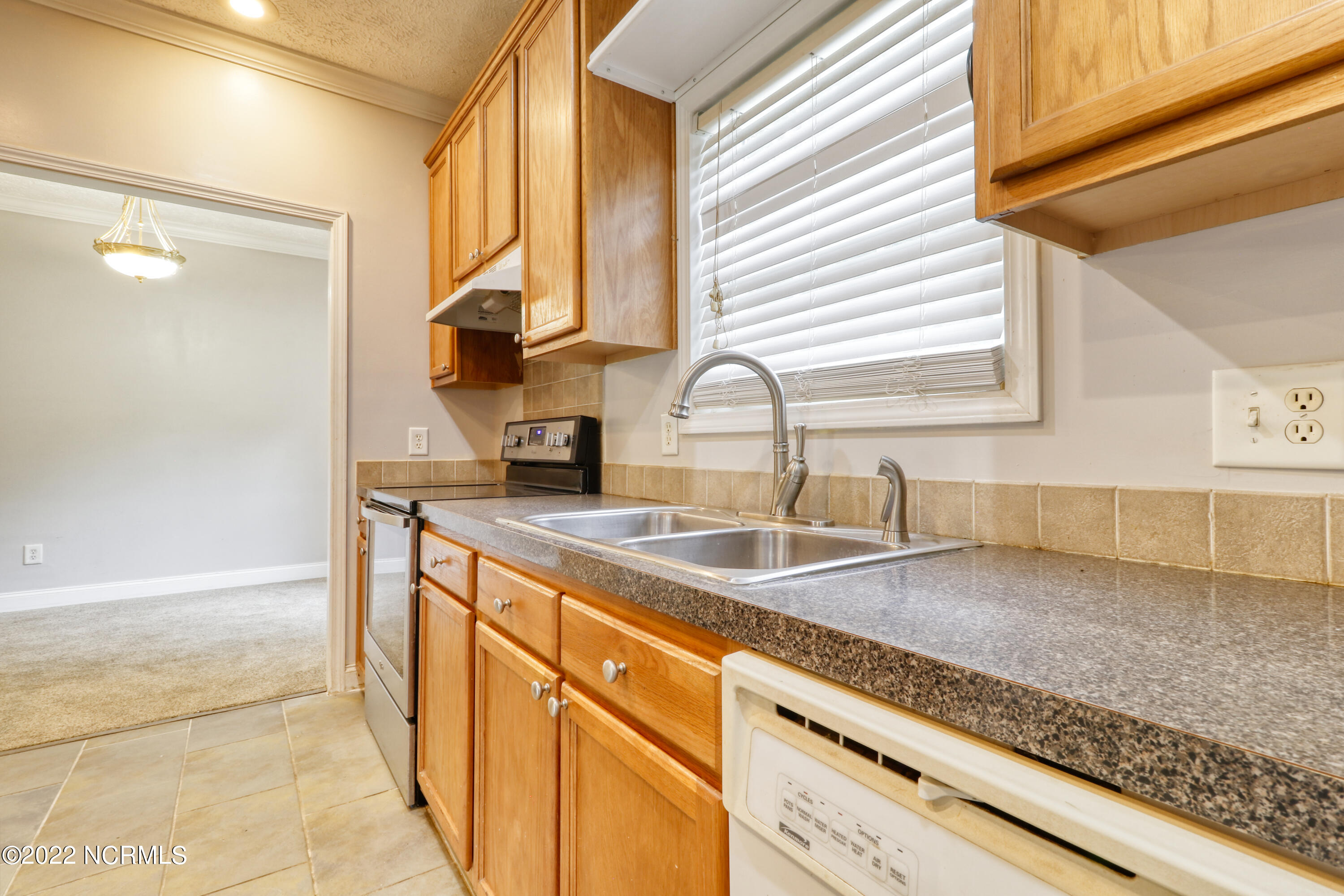 53 Arizona Trail Atkinson, NC 28421 - Photo 8 of 14 Kitchen leading to formal dining room