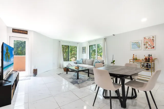 a view of a livingroom with furniture and a window