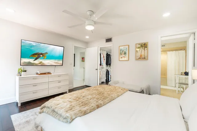 a bedroom with a bed and a dresser