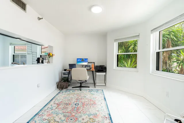 a living room with furniture and a rug