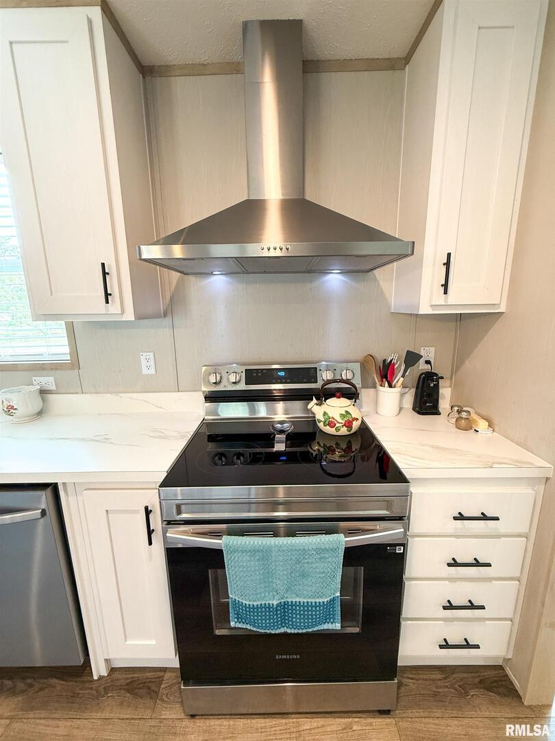 119 South 6th Street Southwest Clay City, IL 62824 - Photo 13 of 90 a stove top oven sitting inside of a kitchen