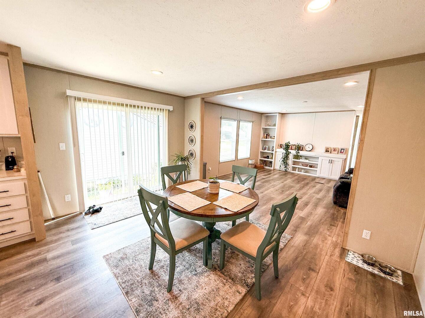 119 South 6th Street Southwest Clay City, IL 62824 - Photo 14 of 90 a view of a dining room with furniture and wooden floor
