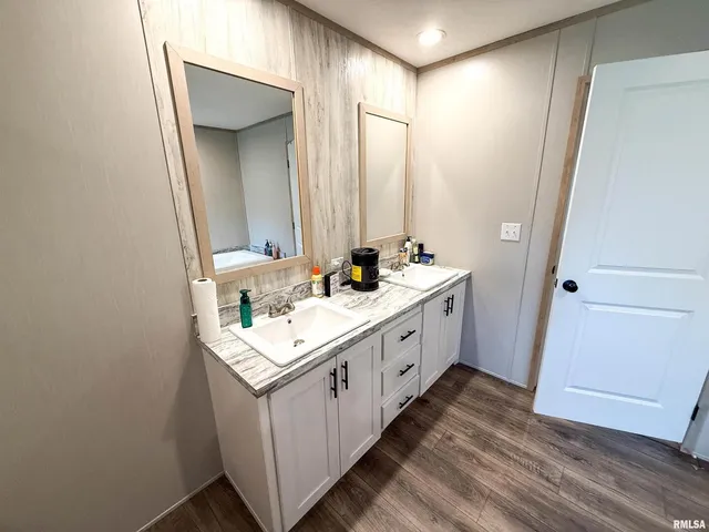 a kitchen with stainless steel appliances sink cabinets and a window