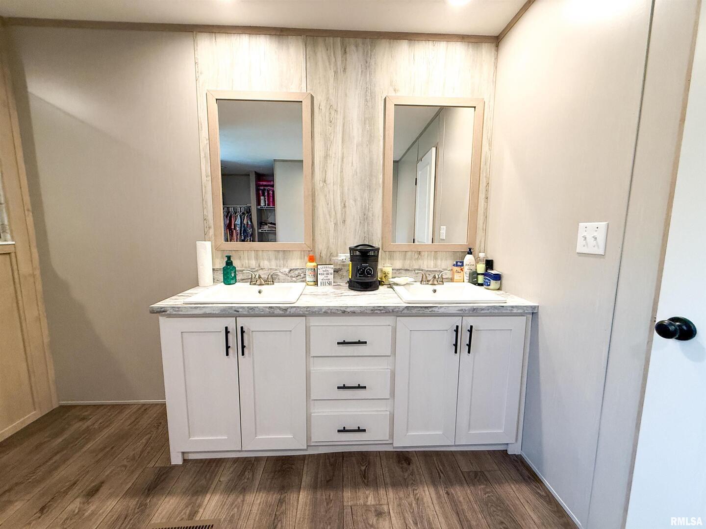 119 South 6th Street Southwest Clay City, IL 62824 - Photo 34 of 90 a bathroom with double vanity sink and mirror