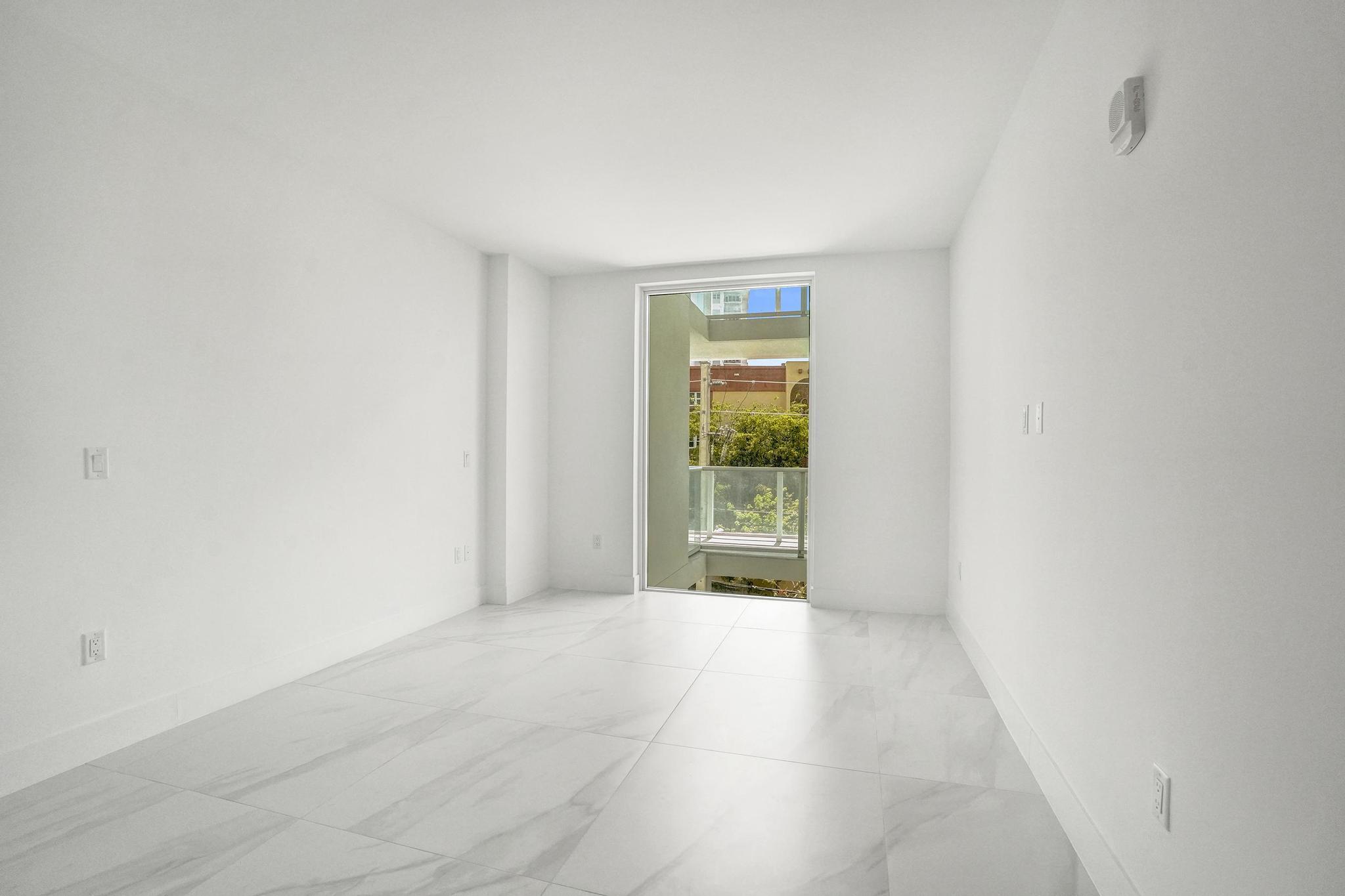 407 North Riverside Drive, Unit 303 Pompano Beach, FL 33062 - Photo 15 of 74 a view of an empty room and window