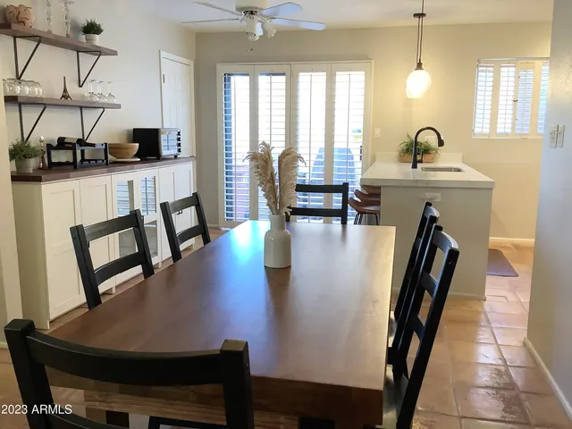 a bedroom with a bed and glass window