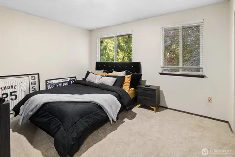 a bedroom with a bed and window