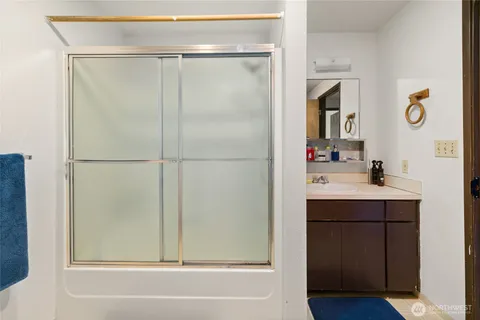 a bathroom with a sink and mirror