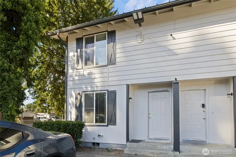 a view of a house with a door and a window