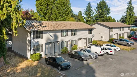 a view of a car park in front of house