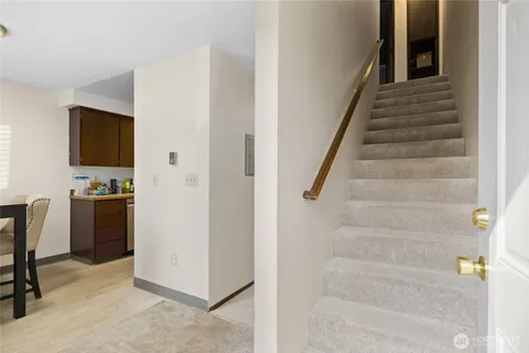 a view of a hallway with workspace and entryway