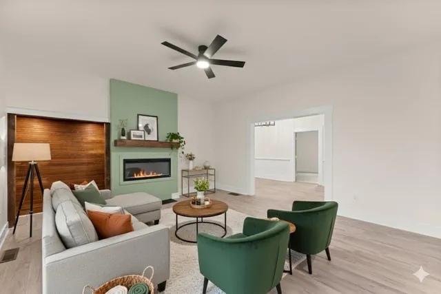 a living room with furniture and a fireplace