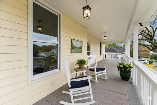 a lobby with furniture and potted plant
