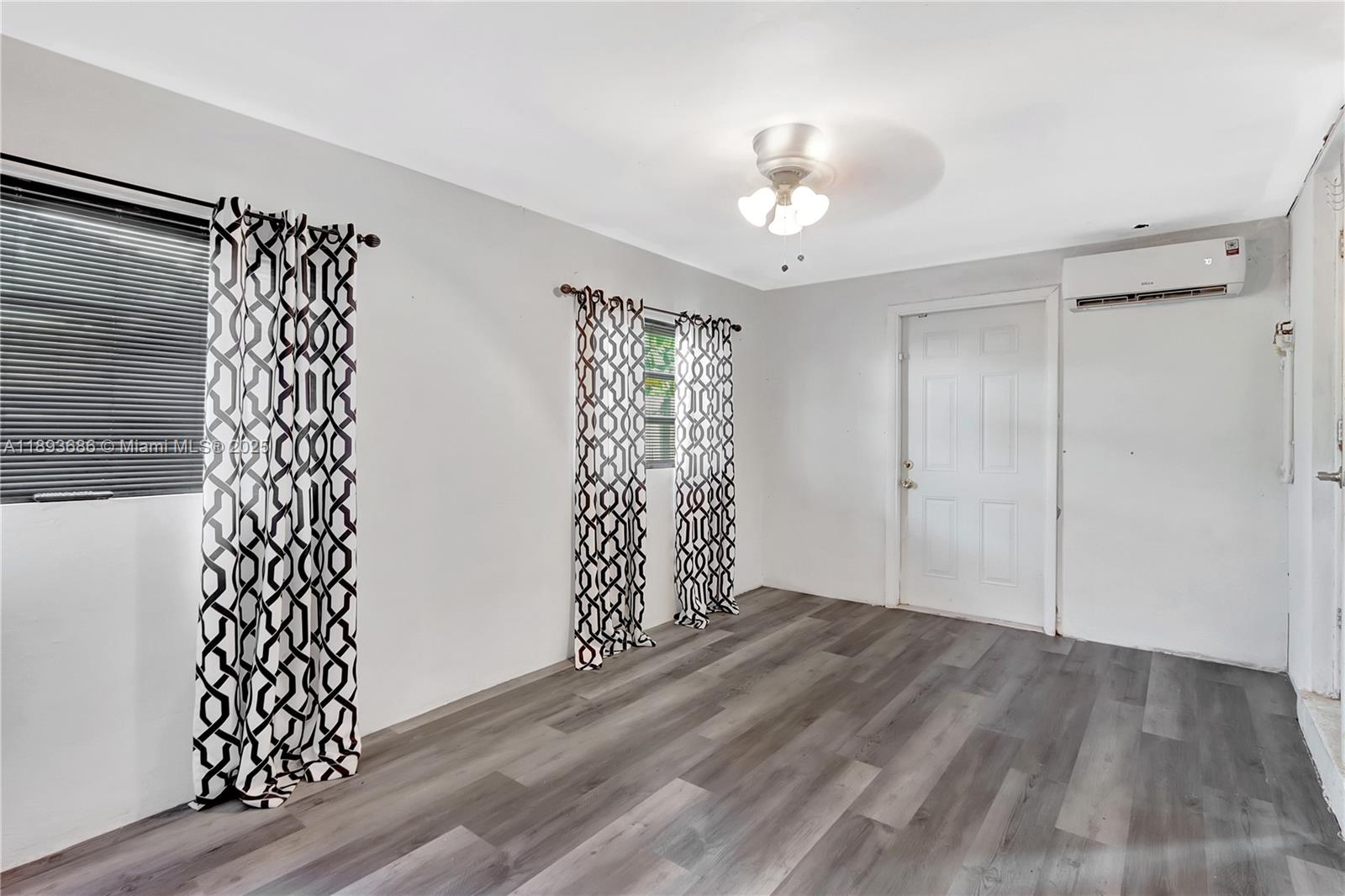 820 Northwest 67th Avenue Margate, FL 33063 - Photo 11 of 17 a view of entryway with wooden floor