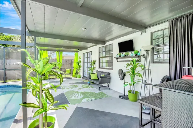 a swimming pool with yard and outdoor seating