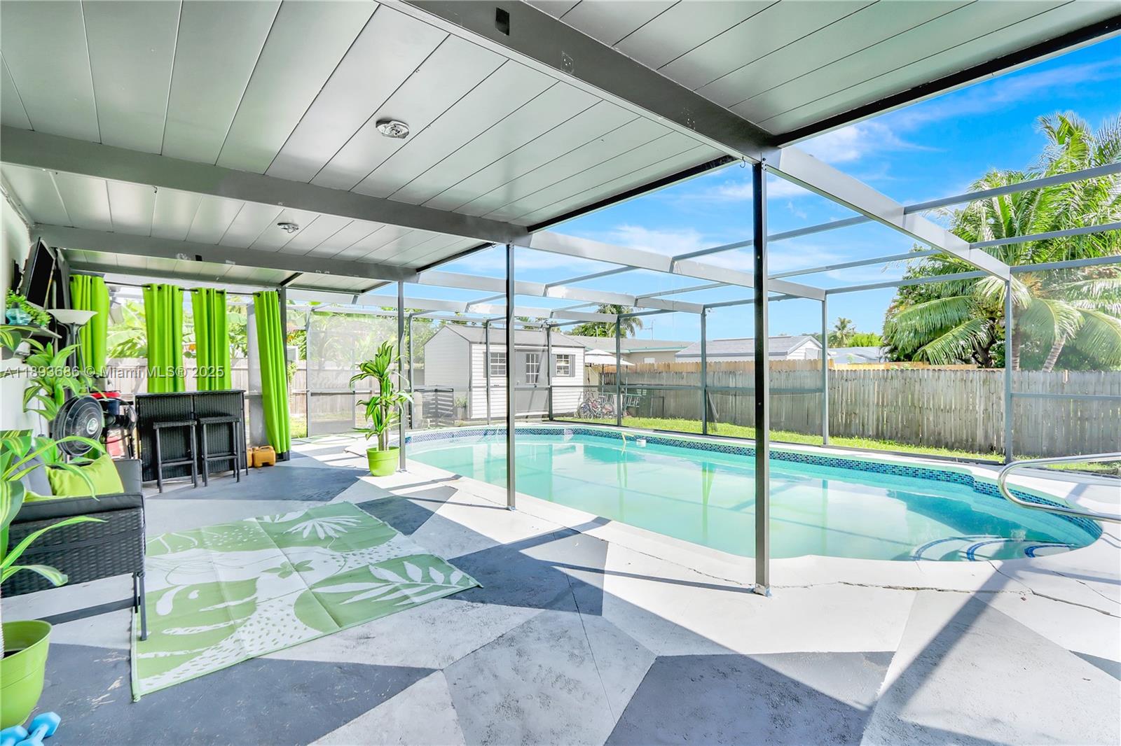 820 Northwest 67th Avenue Margate, FL 33063 - Photo 14 of 17 a swimming pool with yard and outdoor seating