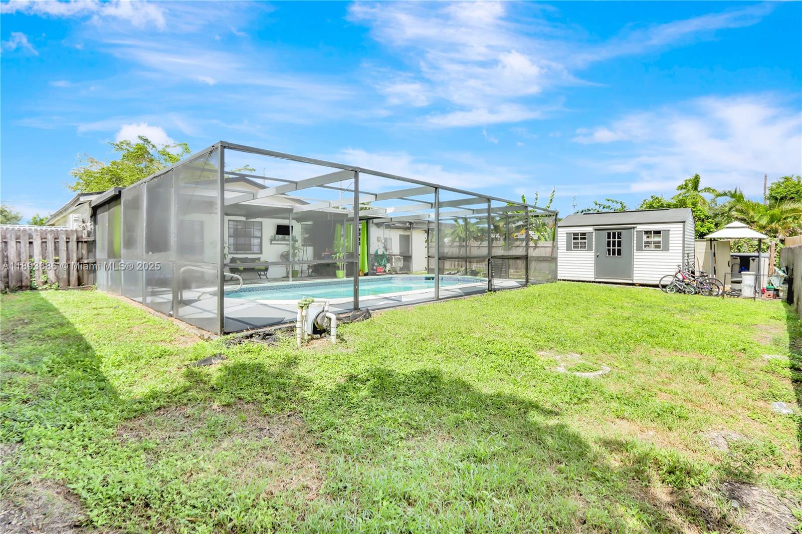 820 Northwest 67th Avenue Margate, FL 33063 - Photo 17 of 17 a backyard of a house with table and chairs